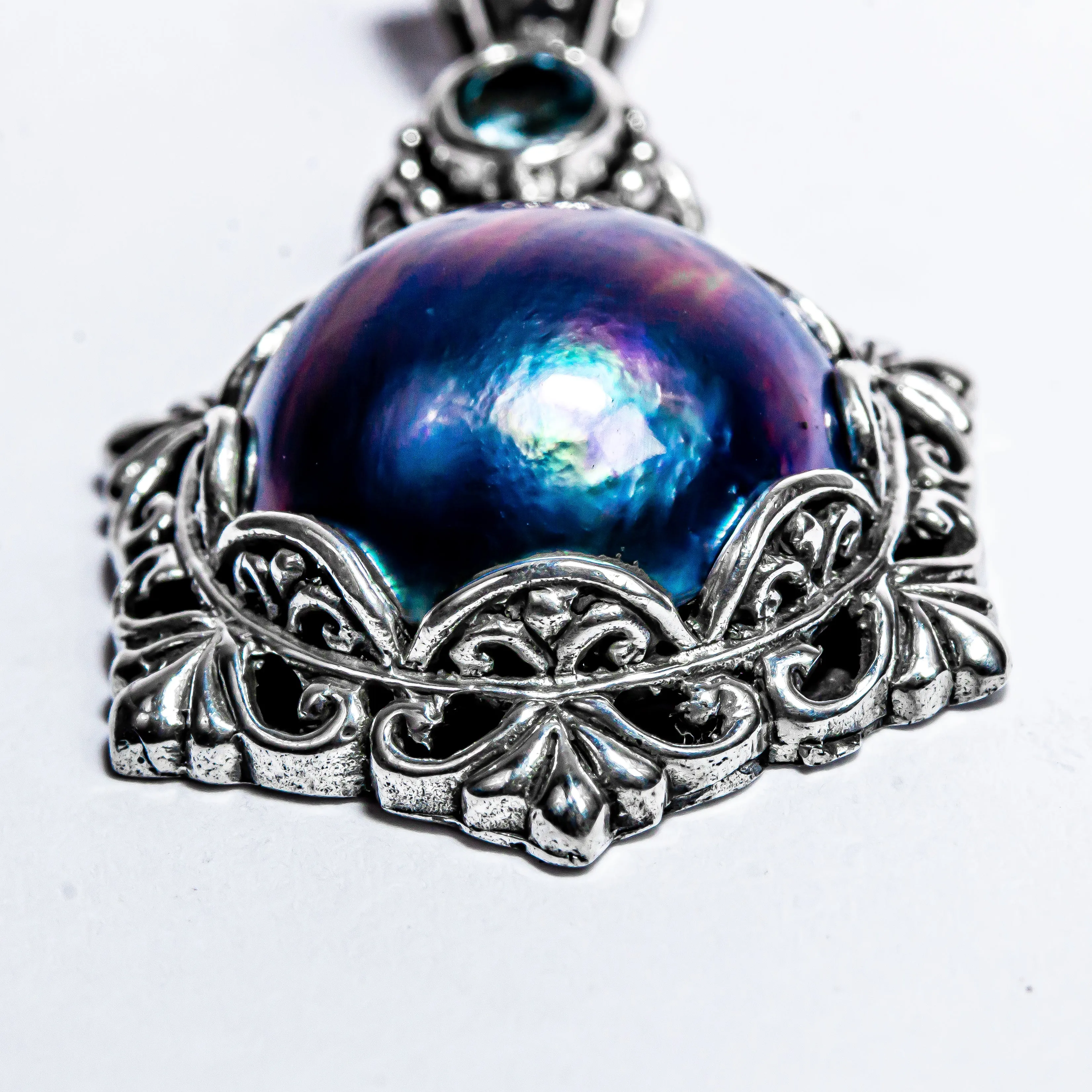 Enchanting Bali Handmade Peacock Mabe Pearl and Sky Blue Topaz pendant in Sterling Silver