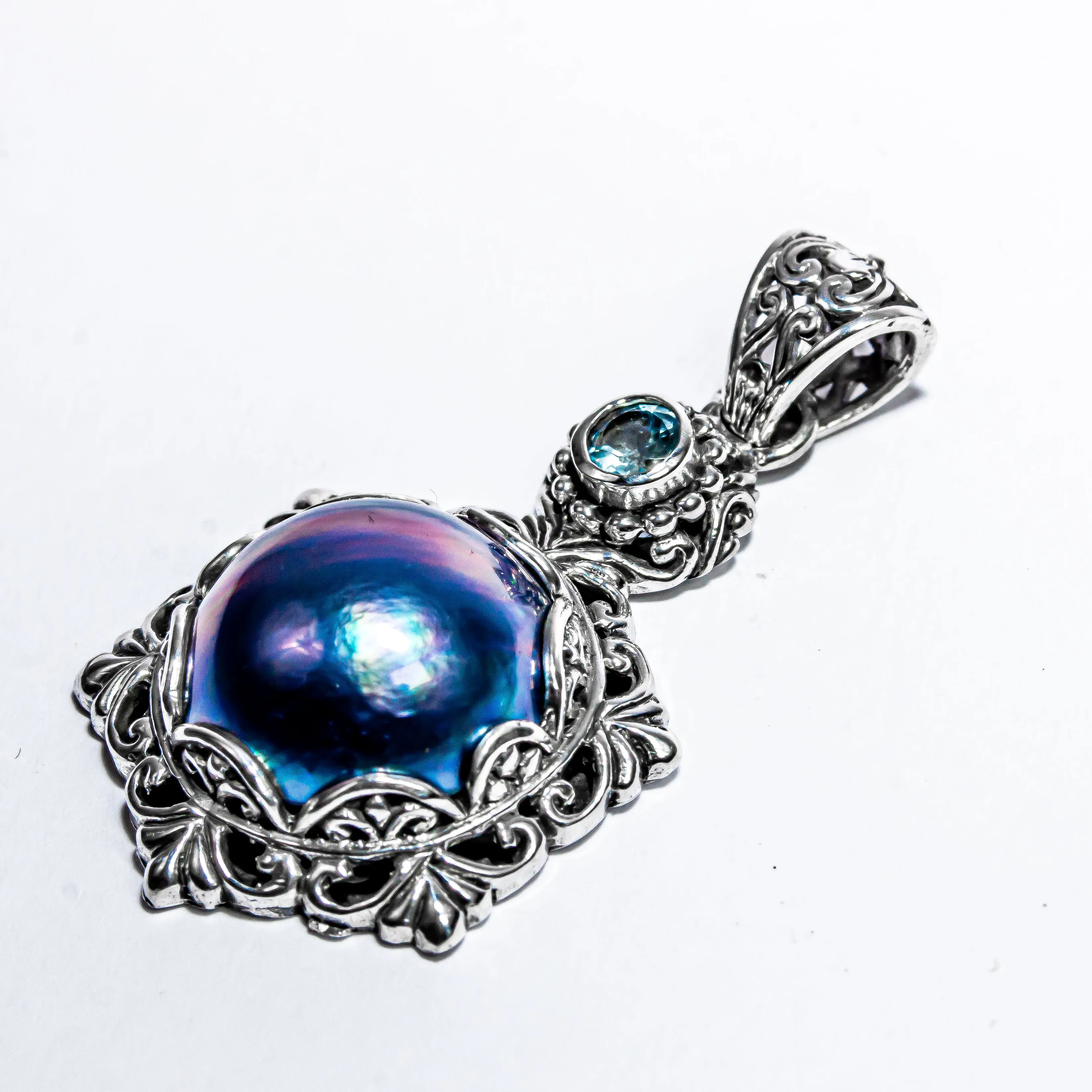 Enchanting Bali Handmade Peacock Mabe Pearl and Sky Blue Topaz pendant in Sterling Silver