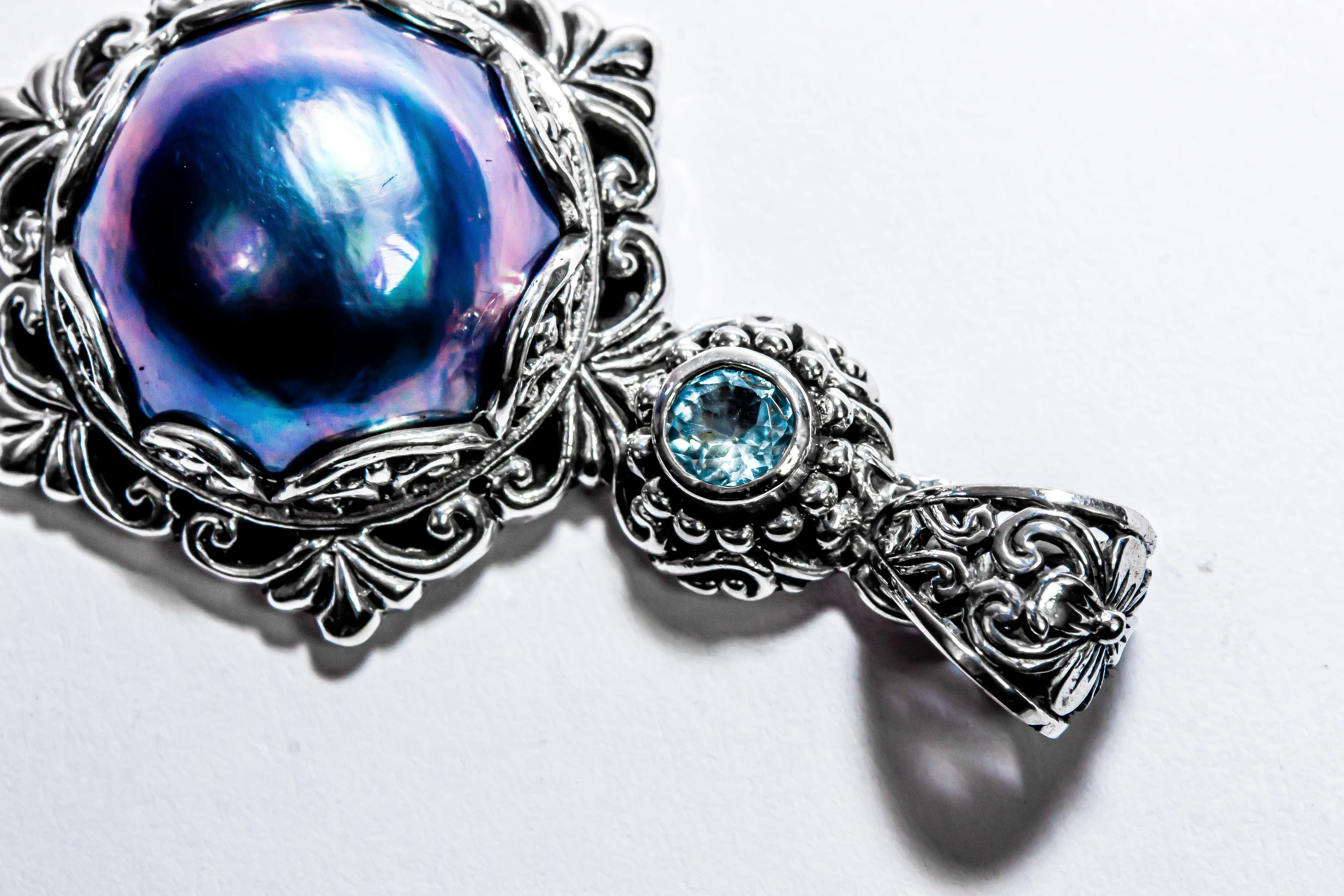 Enchanting Bali Handmade Peacock Mabe Pearl and Sky Blue Topaz pendant in Sterling Silver
