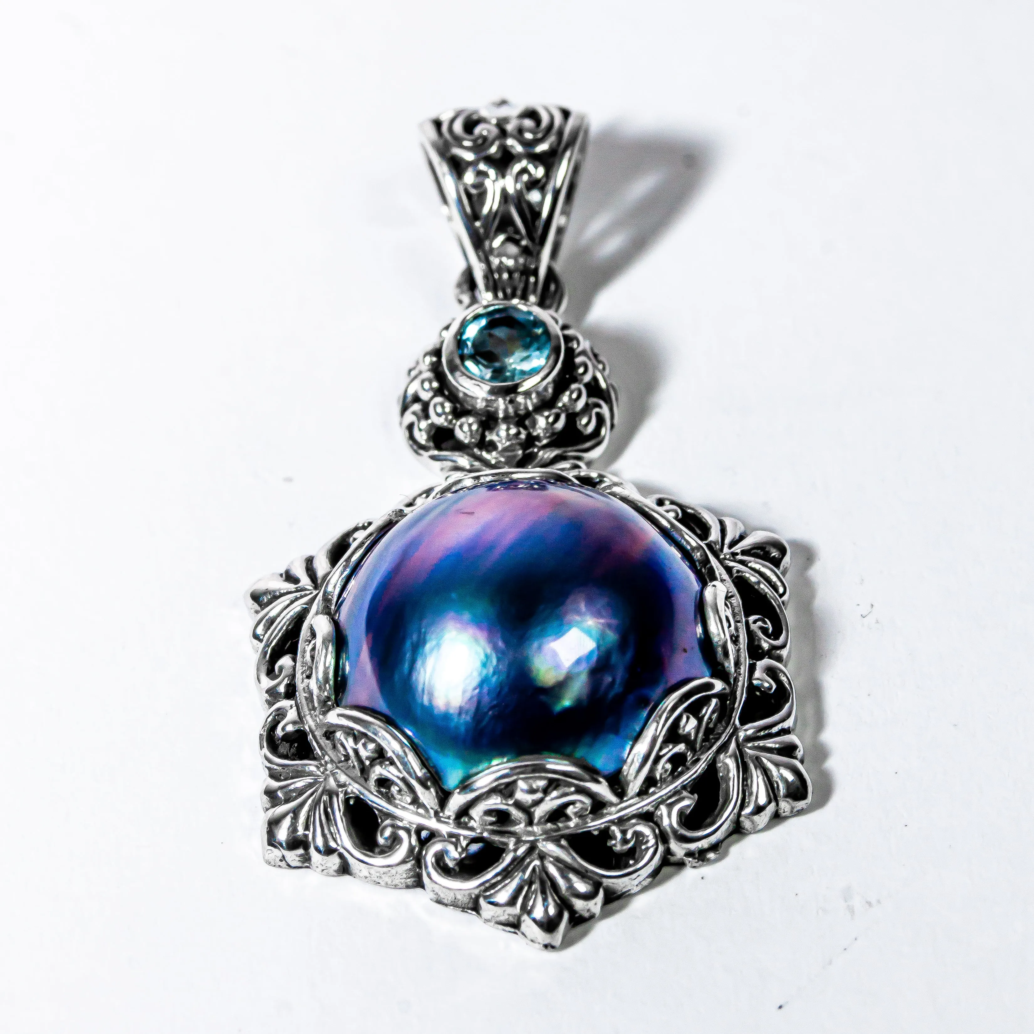 Enchanting Bali Handmade Peacock Mabe Pearl and Sky Blue Topaz pendant in Sterling Silver