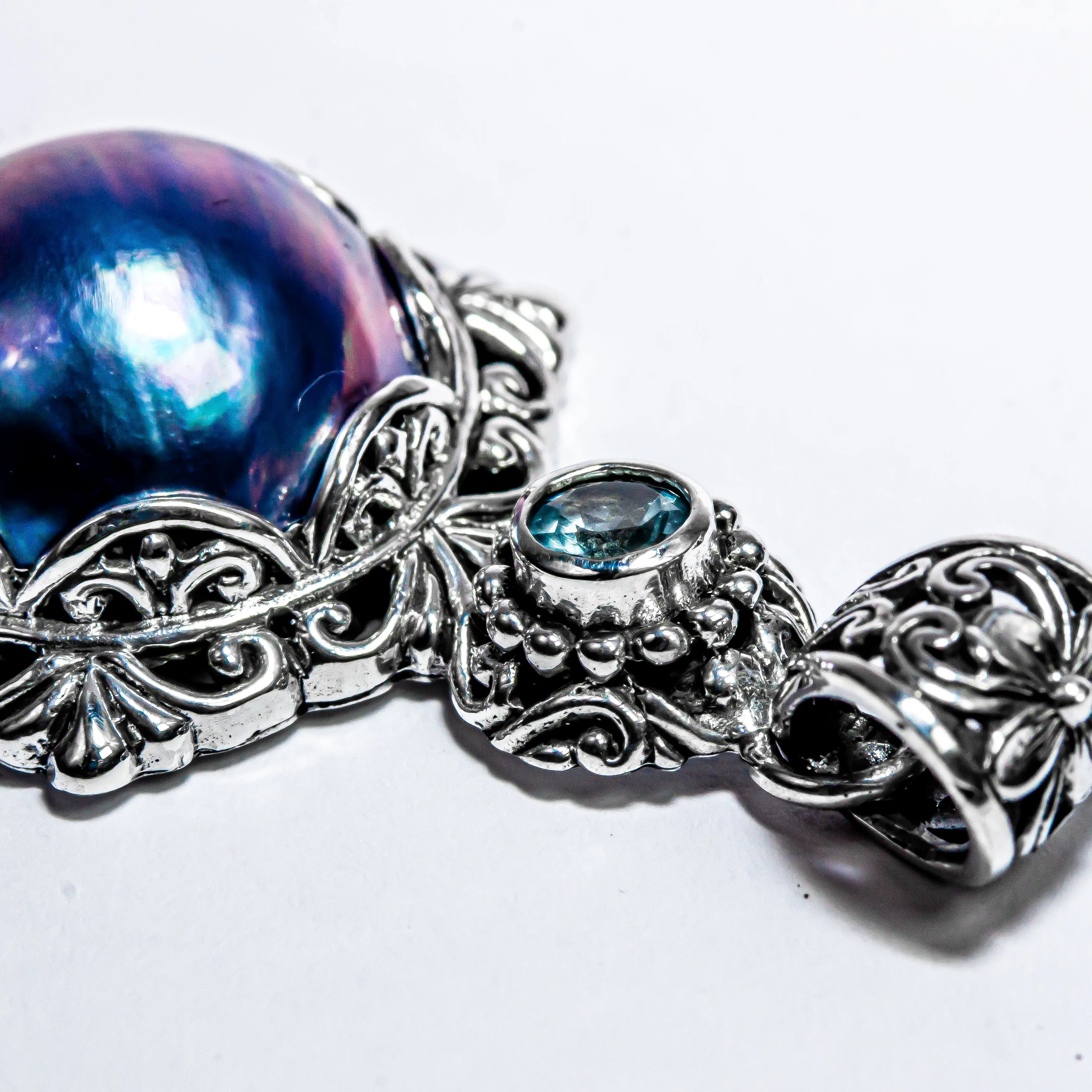 Enchanting Bali Handmade Peacock Mabe Pearl and Sky Blue Topaz pendant in Sterling Silver