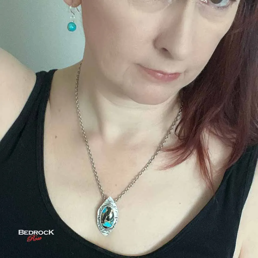Vibrant Kingman Turquoise, Onyx, and Bronze Pendant